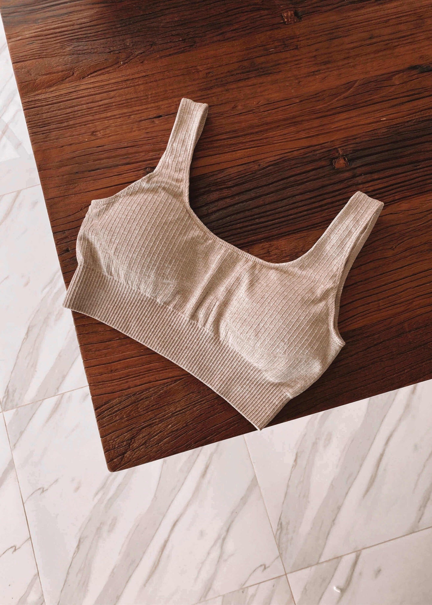 Luxe ribbed material Stretchy Scooped neckline 90%Nylon, 10% Spandex Available in small, medium & large Removable padding