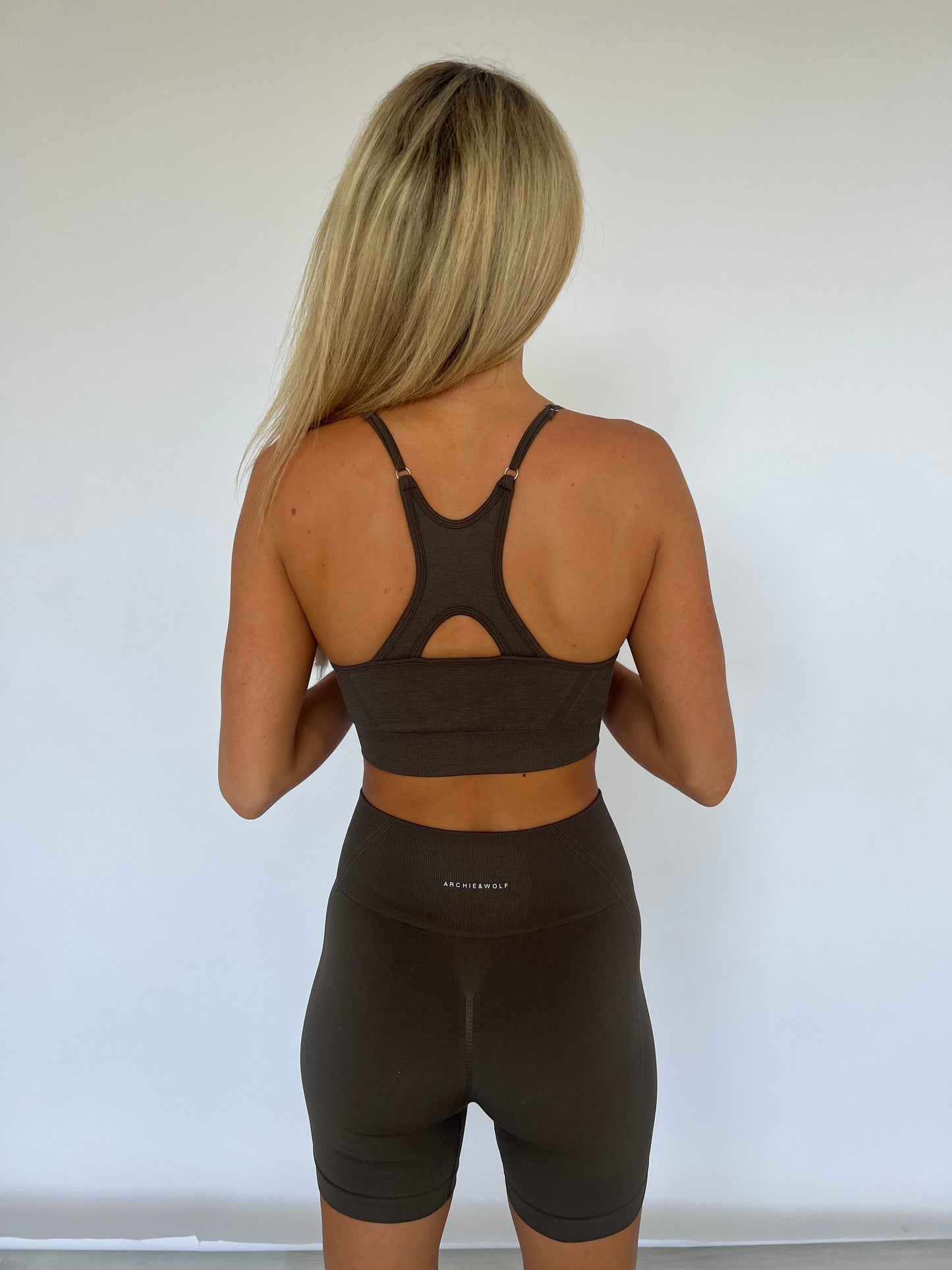 Model wearing Archie & Wolf Tammy Bra in Brown